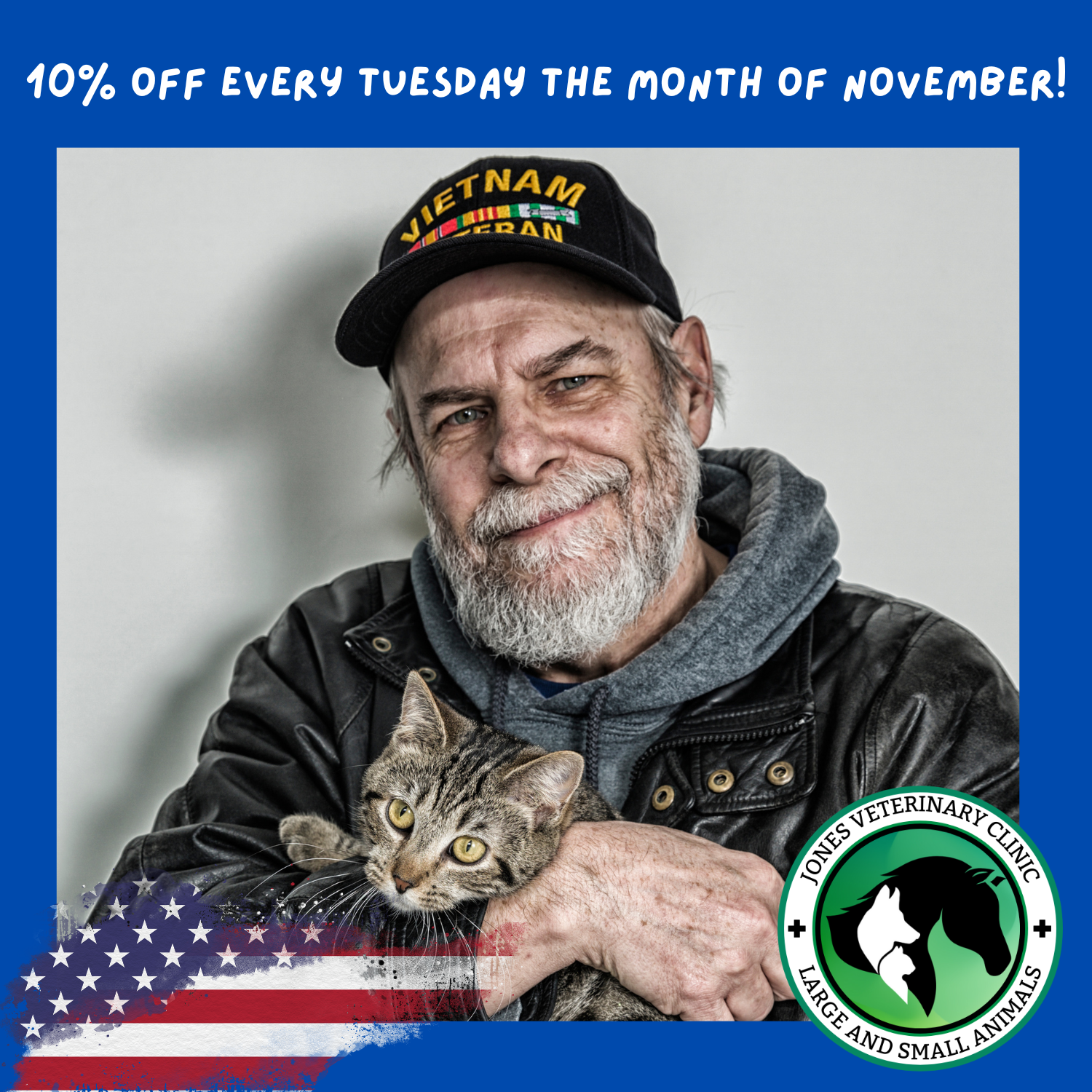 Military man wearing a veteran hat holds cat in arms and smiles.