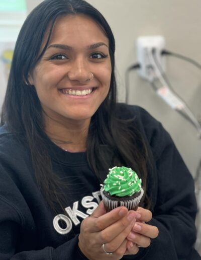 Lady holds a cupcake