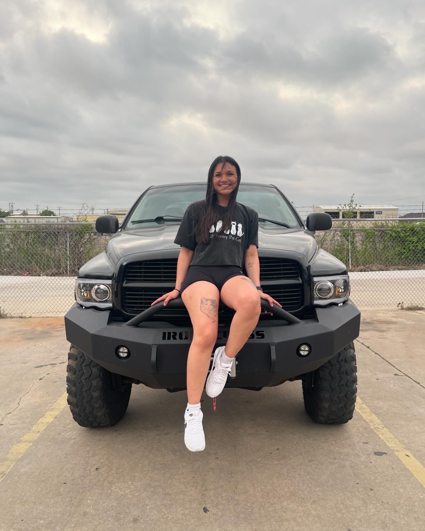 Courtney Herman leaning on truck